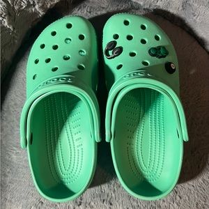 Gently used green crocs